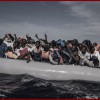 Italian sailors with the Uraniam Navy Ship rescue 109 African migrants from Gambia, Mali, Senegal, Ivory Coast, Guinea, and Nigeria, from a rubber boat in the sea between Italy and Libya, October 4, 2014. The migrants claimed to have left from Tripoli the evening of October 3rd, and spent the night moving north. The Italian Navy has several navy ships patrolling international and Italian waters at any given time in an attempt to rescue migrants, and transfer them safely to shore in Italy.  Since the beginning of 2014, roughly 120,000 refugees have landed in Italy, more than double the total for the entire year of 2013. (Credit: Lynsey Addario for The New York Times)      NYTCREDIT: Lynsey Addario for The New York Times                              NYTCREDIT: Lynsey Addario for The New York Times
